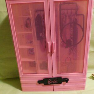One Barbie doll with outfits pictured, accessories and Barbie doll closet